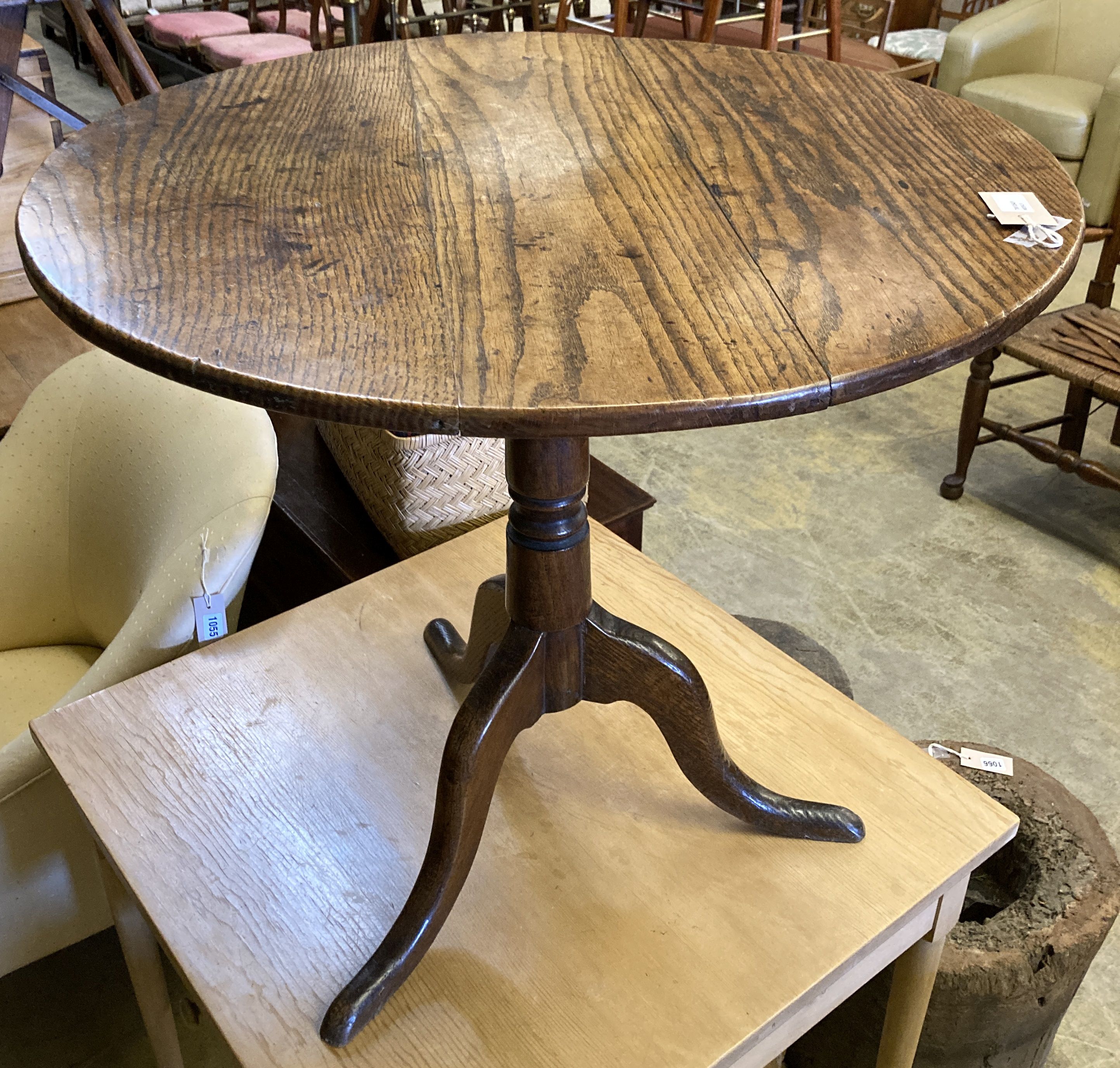 A George III circular oak tea table on tripod base, height 68cm, 78cm diameter